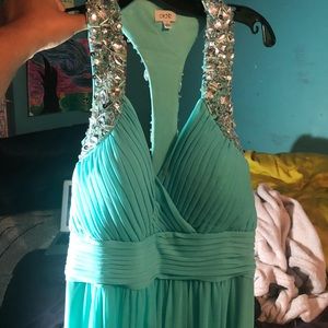 Long teal prom dress with beaded straps